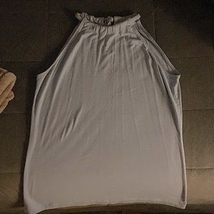 Selling a tank top that ties at the back. No sleeves.
